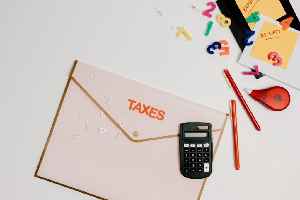 Taxes envelope with calculator and pens for financial planning and tax preparation.