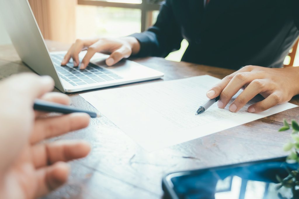 Professional financial planning and consulting session at Daybook Financial Group, focusing on client meetings, financial documents, and investment strategies.