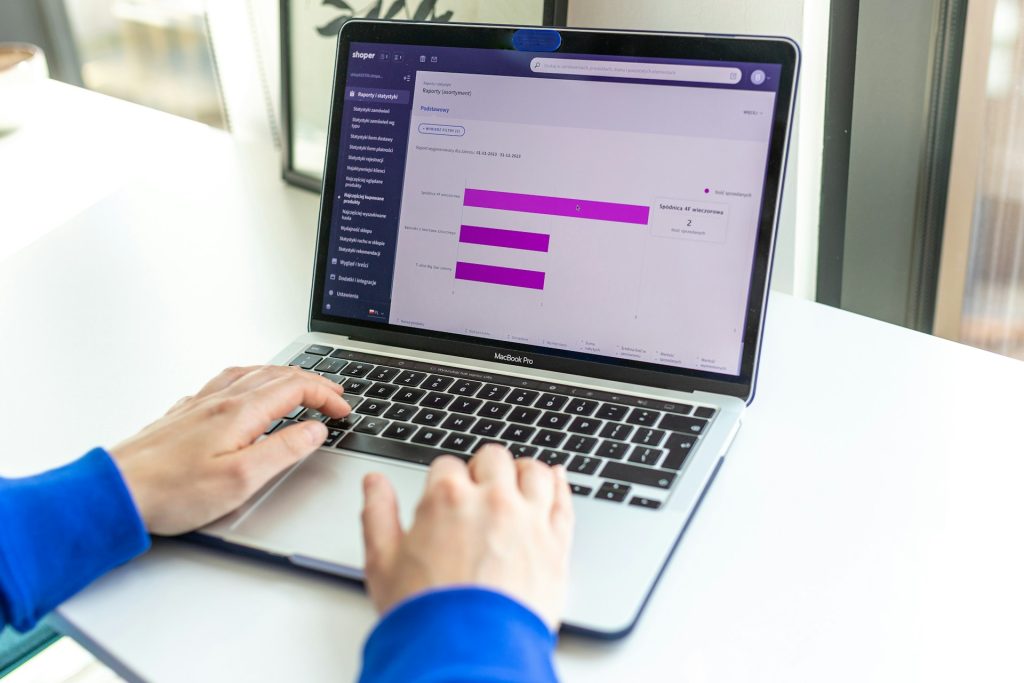 Efficient financial data analysis on a MacBook Pro with business analytics software, showcasing effective financial management and data-driven decision-making for businesses.